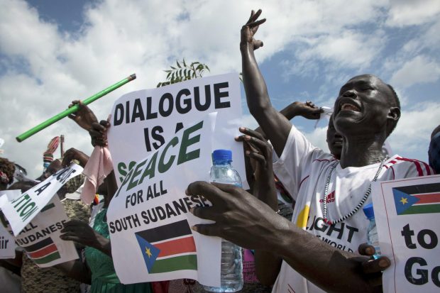 South Sudanese people cheer as they await the arrival back in the country of South Sudan’s President Salva Kiir, at the airport in Juba, South Sudan Friday, June 22, 2018. (Photo: Bullen Chol).