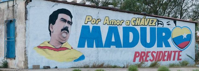 Propaganda in Venezuela: A political painting saying, "For the love of Chávez. President Maduro." with the popular "Chávez eyes" visible.