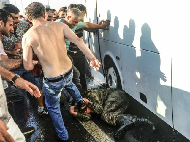 A Turkish soldier who took part in the attempted coup is kicked and beaten by the crowd (Photo: Selcuk Samiloglu).