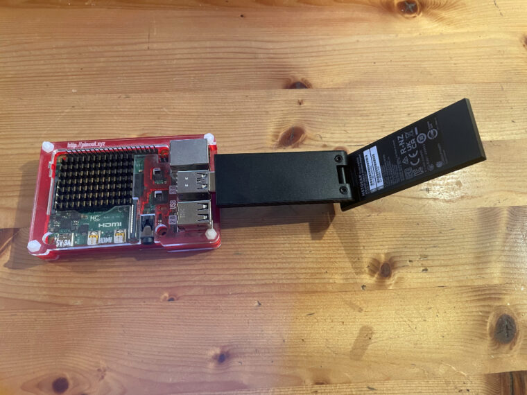 A Raspberry Pi 4 Model B with the Netgear AXE3000 Nighthawk.